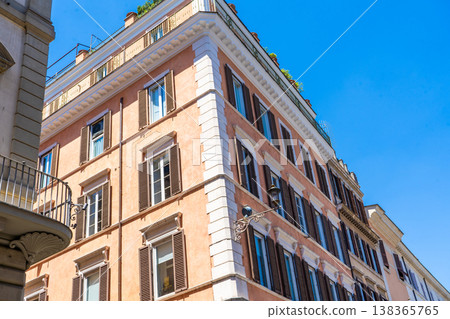 Italy Rome street house facade. Old historical building architecture in the city center. Italian window shutters Italy Rome street house facade. Old historical building architecture in the city center. Italian window shutters 138365765