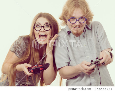 Gaming couple playing games Gaming couple playing games 138365775