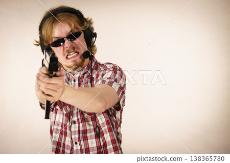 Gamer man shooting from gun 138365780