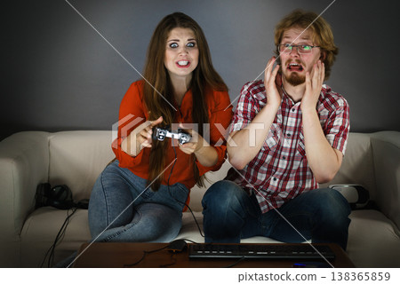 Gamer couple playing games Gamer couple playing games 138365859