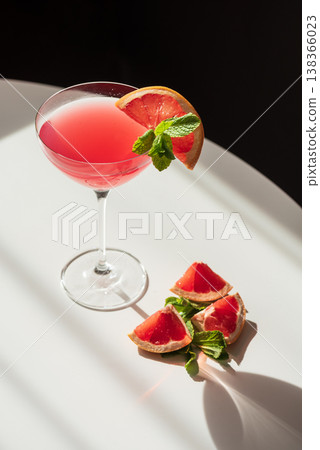 Martini Fiero Cocktail with Grapefruit and Mint. Vibrant Aperitif Martini Fiero Cocktail with Grapefruit and Mint. Vibrant Aperitif 138366023