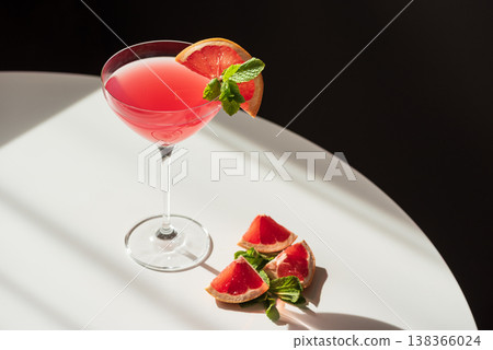 Martini Fiero Cocktail with Grapefruit and Mint. Vibrant Aperitif Martini Fiero Cocktail with Grapefruit and Mint. Vibrant Aperitif 138366024