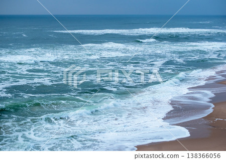 Coastal Cliff and Crashing Ocean Waves on Beach Coastal Cliff and Crashing Ocean Waves on Beach 138366056