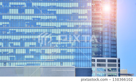 Modern office building with glass facade background. Transparent glass wall of office building. 138366102