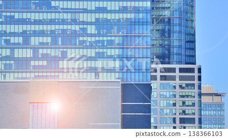Modern office building with glass facade background. Transparent glass wall of office building. 138366103