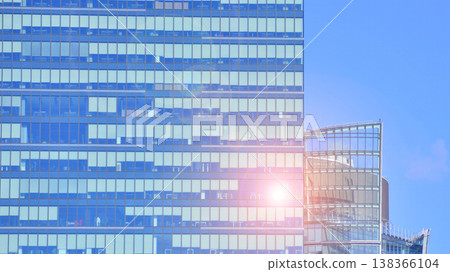 Modern office building with glass facade background. Transparent glass wall of office building. 138366104