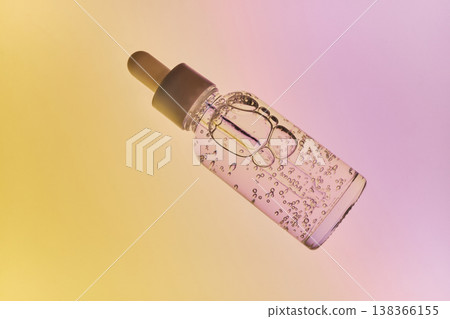 Beauty serum bottle with pipette showing liquid and bubbles for cosmetic wellness 138366155