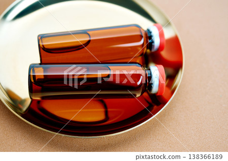Amber glass vials holding pharmaceutical liquid for research 138366189