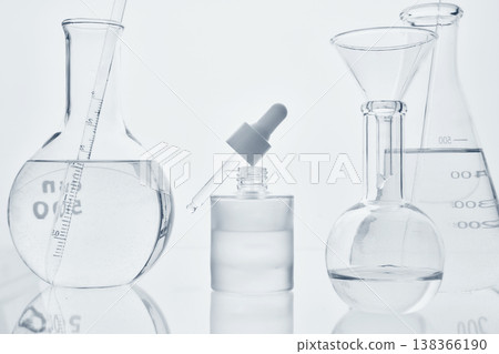Laboratory glassware preparing cosmetic serum for skincare research Laboratory glassware preparing cosmetic serum for skincare research 138366190