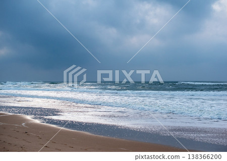 Scenic Ocean Beach with Cliff and Crashing Waves Scenic Ocean Beach with Cliff and Crashing Waves 138366200
