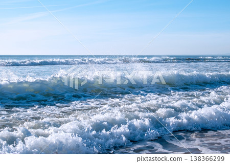 Powerful Sea Waves Rolling onto Sandy Beach Below Cliff Powerful Sea Waves Rolling onto Sandy Beach Below Cliff 138366299