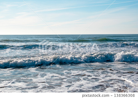 Sea Waves Rolling Over Rocks on Sandy Cliff Beach Sea Waves Rolling Over Rocks on Sandy Cliff Beach 138366308