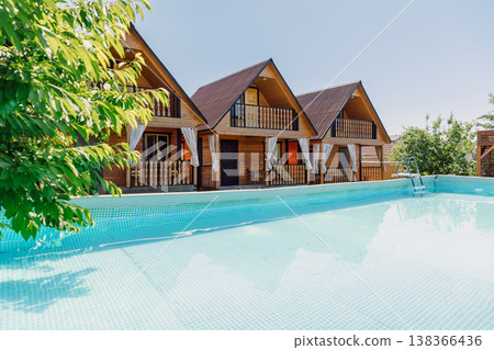 Wooden cottages with swimming pool, sunny summer vacation resort with clear blue water, homestay 138366436