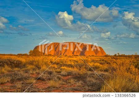 Ayers Rock or Uluru respectively at sun set with artificial clouds Ayers Rock or Uluru respectively at sun set with artificial clouds 138366526