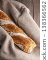 Freshly baked french baguette in on wooden background. High quality photo 138366562
