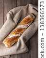 Freshly baked french baguette in on wooden background. High quality photo 138366573
