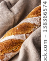 Freshly baked french baguette in on wooden background. High quality photo 138366574