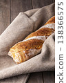 Freshly baked french baguette in on wooden background. High quality photo 138366575