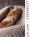 Freshly baked french baguette in on wooden background. High quality photo 138366577