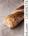 Freshly baked french baguette in on wooden background. High quality photo 138366578