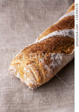Freshly baked french baguette in on wooden background. High quality photo 138366578