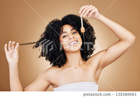 Hair, beauty and portrait of woman with honey, natural care and oil treatment on studio background with happiness. Happy, African haircare and product with honeycomb, moisture and sugar benefits Hair, beauty and portrait of woman with honey, natural care and oil treatment on studio background with happiness. Happy, African haircare and product with honeycomb, moisture and sugar benefits 138366661