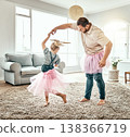 Family, dance or ballet with a father and daughter together in costume, having fun in the home living room. Love, kids or fantasy and a girl child dancing with her man parent on a carpet in the house 138366719