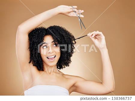 Cutting, hair care and woman with scissors, smile and excited on a brown studio background. Person, happy girl and model with afro, curly and wow with growth, mockup space and grooming with aesthetic 138366737