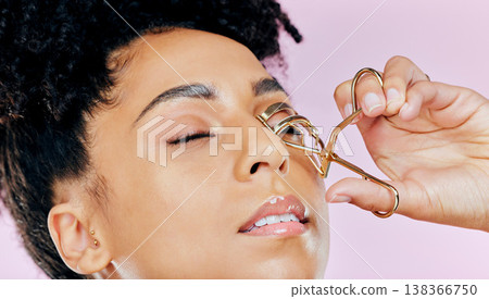 Face, skin and lashes curler with woman and beauty in a studio, wellness and cosmetic care on pink background. Makeup tools, makeover or transformation with shine, eyelash product with metal Face, skin and lashes curler with woman and beauty in a studio, wellness and cosmetic care on pink background. Makeup tools, makeover or transformation with shine, eyelash product with metal 138366750