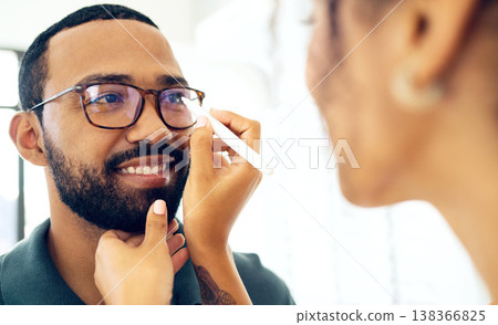 Vision, glasses and eye test with a man at the optometrist for a prescription frame lens assessment. Face, smile and eyewear with a customer talking to a consultant at the optician for assistance Vision, glasses and eye test with a man at the optometrist for a prescription frame lens assessment. Face, smile and eyewear with a customer talking to a consultant at the optician for assistance 138366825