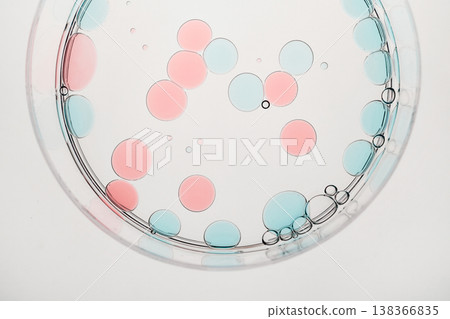 Round colorful droplets floating in liquid, creating abstract scientific background Round colorful droplets floating in liquid, creating abstract scientific background 138366835
