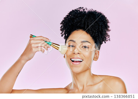 Woman, smile and brush for makeup in studio on pink background in mockup for portrait, cosmetic or beauty. African, person and happiness on face for product, foundation or confidence of glowing skin 138366851