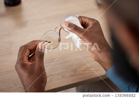 Hands, glasses and fabric for cleaning, closeup and maintenance for dust, frame and eye health in home. Person, cloth and spectacles for optometry, vision and wellness for eyesight at table in house 138366882