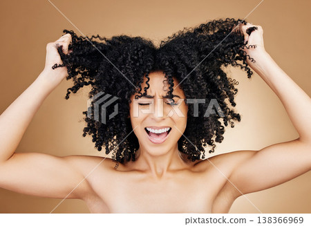 Woman screaming, hair crisis and beauty fail, salon treatment regret and frustrated isolated on studio background. Haircare disaster, damage with pain, afro growth or texture mistake with stress 138366969