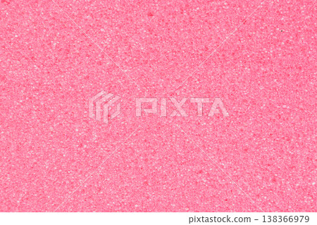 Macro shot of a pink foam sponge with a fine porous structure and dense cells. The soft pastel texture creates an organic pattern resembling delicate coral Macro shot of a pink foam sponge with a fine porous structure and dense cells. The soft pastel texture creates an organic pattern resembling delicate coral 138366979