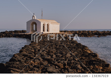 Picturesque seclusion: the whitewashed chapel on a narrow rock jetty extending into the Aegean Picturesque seclusion: the whitewashed chapel on a narrow rock jetty extending into the Aegean 138367019