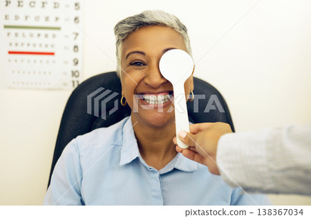Eye exam, woman or portrait with cover for vision, healthcare or test at optometrist or optometry. Eyes assessment, ophthalmology or person for medical support, glaucoma or retina testing or smile Eye exam, woman or portrait with cover for vision, healthcare or test at optometrist or optometry. Eyes assessment, ophthalmology or person for medical support, glaucoma or retina testing or smile 138367034