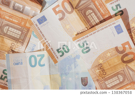 Twenty and fifty euro banknotes as flat lay pattern. Top view photo European paper money Twenty and fifty euro banknotes as flat lay pattern. Top view photo European paper money 138367058