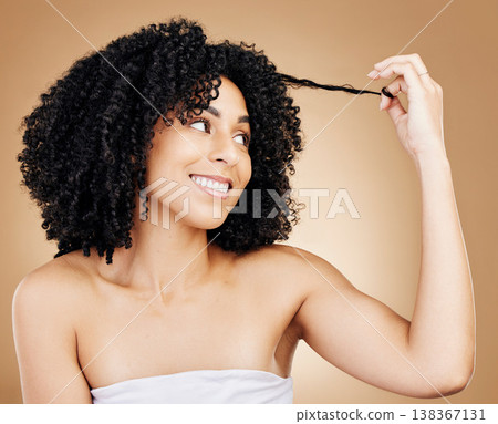 Afro, happy woman and beauty of hair strand in studio for natural growth, coil textures or results on brown background. Model, curly hairstyle or care of salon aesthetic, keratin treatment or shampoo Afro, happy woman and beauty of hair strand in studio for natural growth, coil textures or results on brown background. Model, curly hairstyle or care of salon aesthetic, keratin treatment or shampoo 138367131