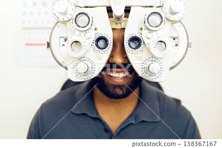 Eye test, face or happy man consulting to help eyesight at optometrist for a optical assessment. Optometry, wellness or customer in clinic for vision, iris or retina health with machine or phoropter 138367167