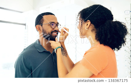 Man, woman optometrist and glasses fitting in store with prescription, eye care and healthy vision. Male customer, consulting and optician with spectacles for better eyesight, reading and wellness Man, woman optometrist and glasses fitting in store with prescription, eye care and healthy vision. Male customer, consulting and optician with spectacles for better eyesight, reading and wellness 138367175