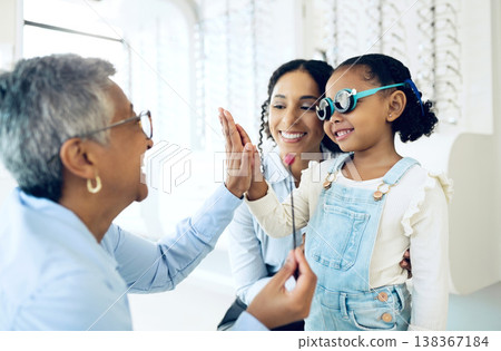 High five, children and a family with a happy optometrist in a clinic for an eye exam to test for prescription frame lenses. Support, motivation or trust with a girl and her parent at the optician 138367184