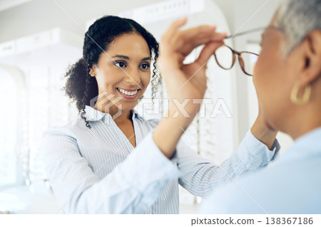Optometrist, eye care choice or customer with glasses for vision in a retail optical or eyewear shop. Happy woman, smile or client with new spectacles, frame or doctor at optics clinic store for help Optometrist, eye care choice or customer with glasses for vision in a retail optical or eyewear shop. Happy woman, smile or client with new spectacles, frame or doctor at optics clinic store for help 138367186