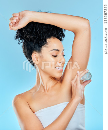 Face, woman and deodorant for hygiene in studio on blue background with mockup in for self care, armpit and fresh. African person, model and natural for beauty, cosmetic and application for treatment Face, woman and deodorant for hygiene in studio on blue background with mockup in for self care, armpit and fresh. African person, model and natural for beauty, cosmetic and application for treatment 138367223