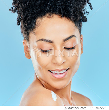Skincare, face and happy woman with body cream, lotion or moisturizer for self care, collagen treatment or skin hydration. Sunscreen protection, shoulder and studio model smile on blue background 138367228