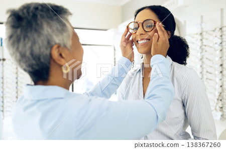Optometry, consulting and women with glasses for decision, choice and eye care option in optician store. Healthcare, ophthalmology and people in clinic for prescription lens, spectacles and frames Optometry, consulting and women with glasses for decision, choice and eye care option in optician store. Healthcare, ophthalmology and people in clinic for prescription lens, spectacles and frames 138367260
