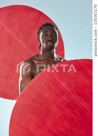 Portrait, black man and muscle with creativity, fitness and artistic on a blue studio background. Face, African person and model with red circle, art and exercise with aesthetic, proud and mockup Portrait, black man and muscle with creativity, fitness and artistic on a blue studio background. Face, African person and model with red circle, art and exercise with aesthetic, proud and mockup 138367276