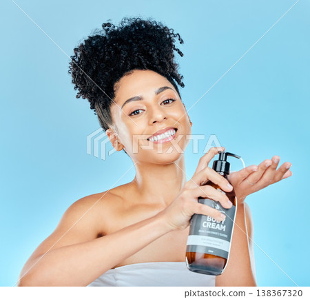 Skincare, portrait and happy woman with body cream bottle, container or product for self care, collagen or skin hydration. Morning routine, dermatology studio and salon girl smile on blue background Skincare, portrait and happy woman with body cream bottle, container or product for self care, collagen or skin hydration. Morning routine, dermatology studio and salon girl smile on blue background 138367320