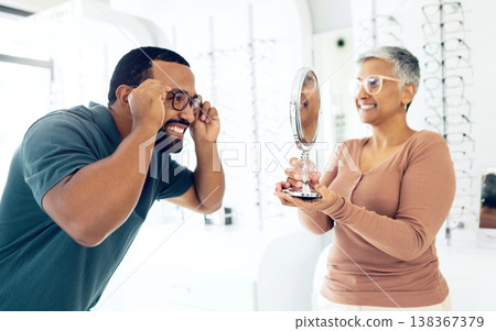 Optometry, doctor and patient with glasses choice in store, health and insurance with communication and vision. Service, help and trust with mirror, eye care consultation with man and woman in clinic Optometry, doctor and patient with glasses choice in store, health and insurance with communication and vision. Service, help and trust with mirror, eye care consultation with man and woman in clinic 138367379