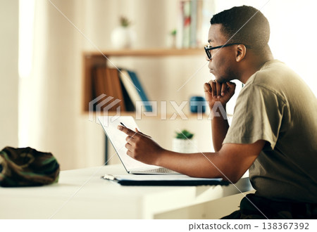 Black man, laptop and reading military information, planning or army surveillance indoor at base. Computer, soldier and concentration on web research at data center for cyber security and protection Black man, laptop and reading military information, planning or army surveillance indoor at base. Computer, soldier and concentration on web research at data center for cyber security and protection 138367392